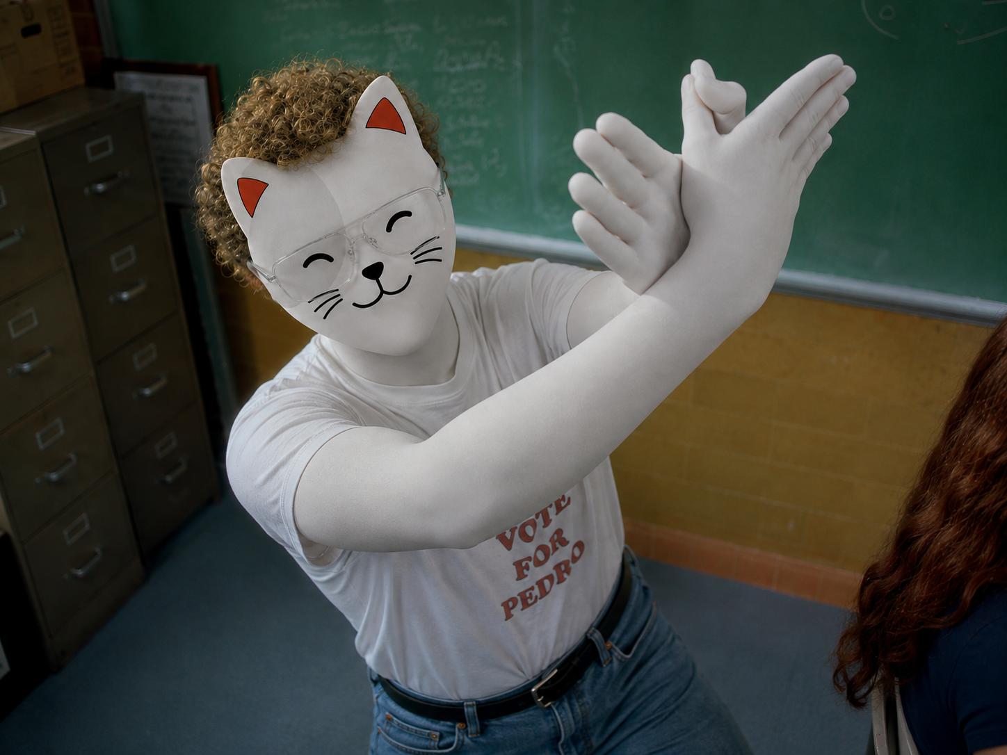 Purr Cat clapping in a classroom
