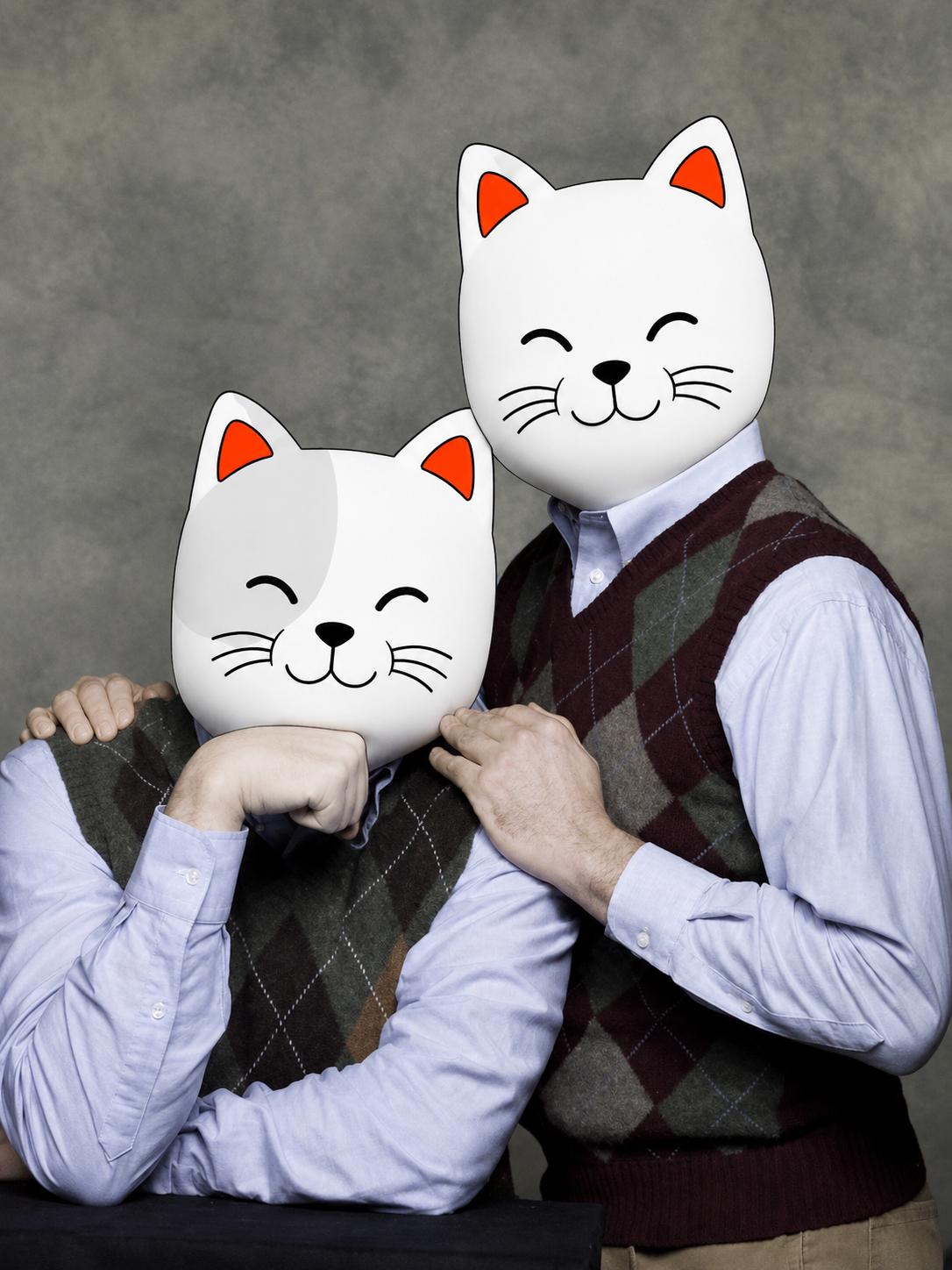 Two Purr Cats posing for a family portrait
